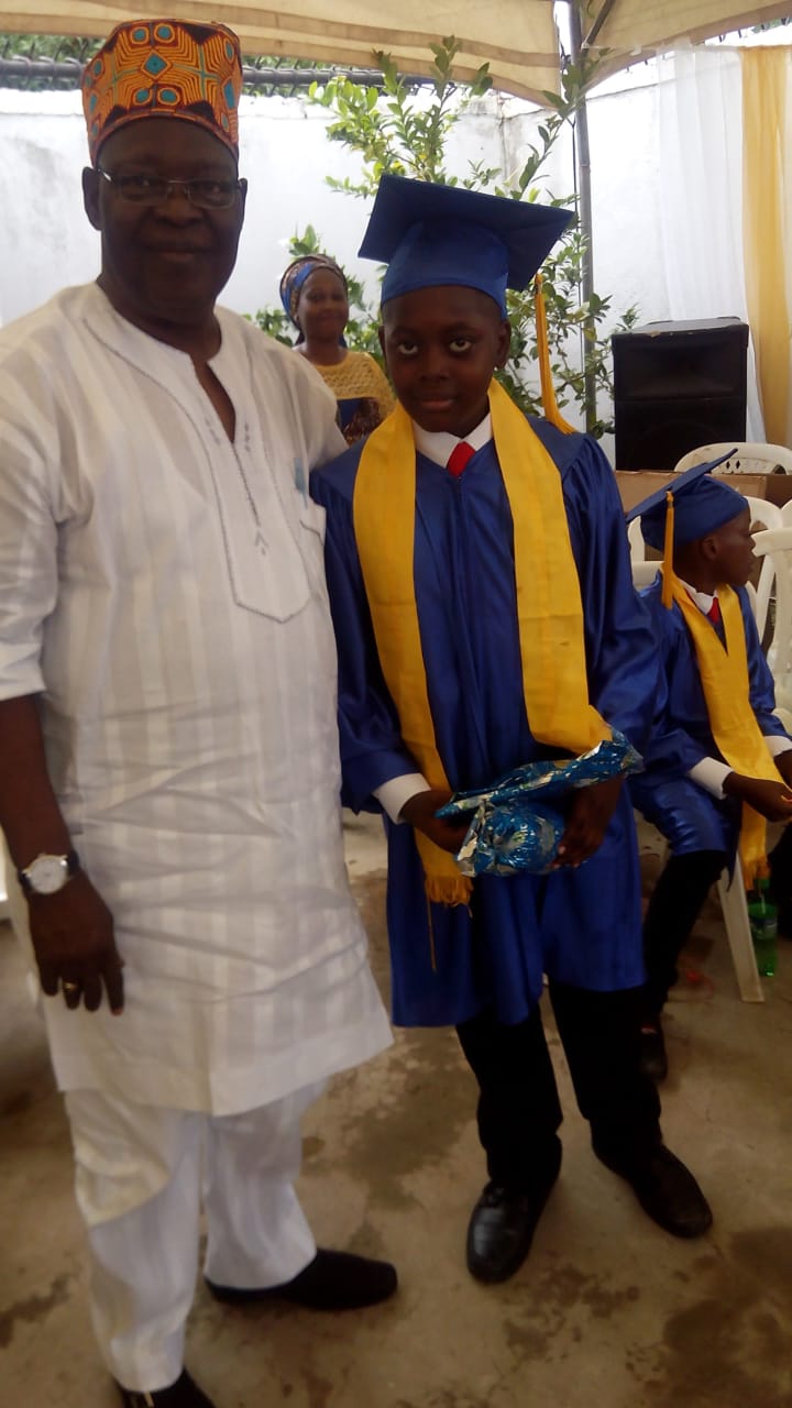 GrandPa OGUNTONA with a Baybos graduate on Graduation Day 2017