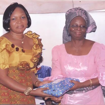 GrandMa OGUNTONA, Proprietress, receiving an appreciation gift